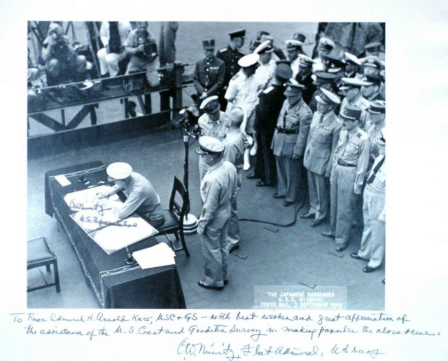 Copy of Admiral Chester Nimitz signing Japanese surrender document at the end of World War II Picture