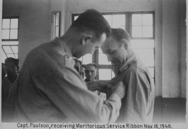 Major Marvin Paulson receiving Army Meritorious Service Ribbon for service in the Philippines helping in the reconstruction, clearing, and recharting  Picture