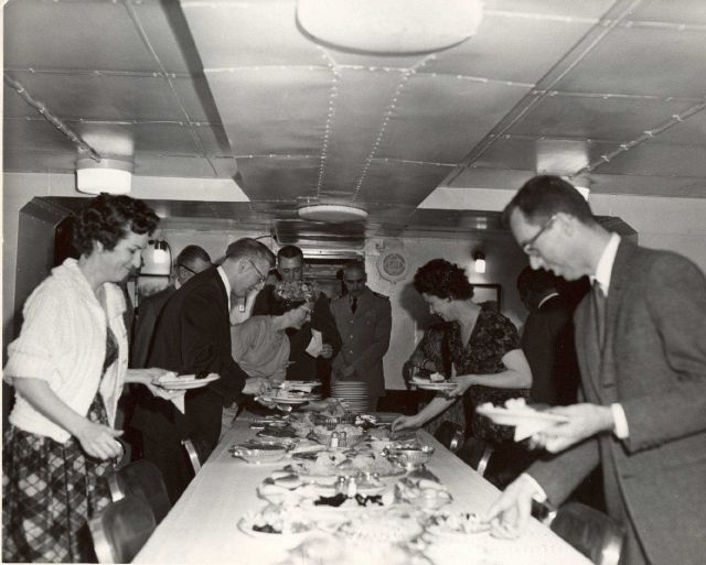 Visitors from Seward have lunch aboard the PATHFINDER. Picture