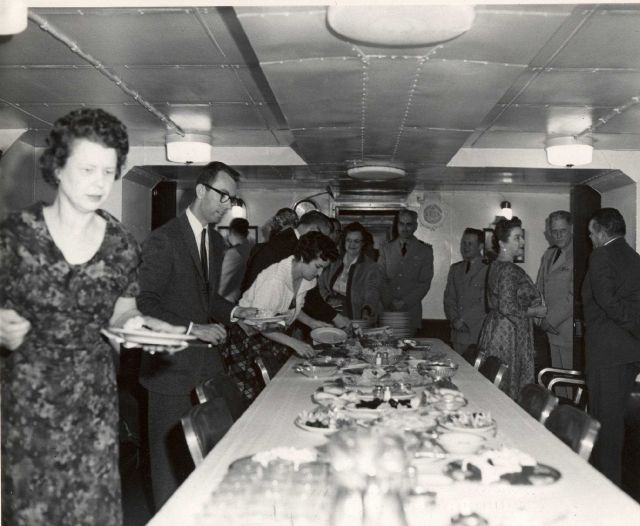Visitors from Seward have lunch aboard the PATHFINDER. Picture