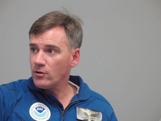 Lieutenant Commander Carl Newman at briefing prior to flying into Hurricane Ike. Picture