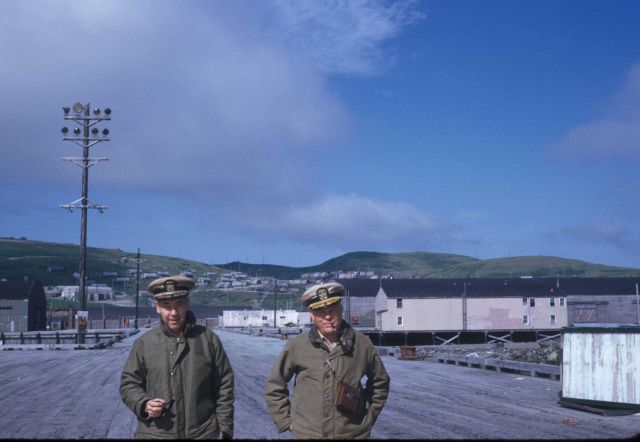 Commander Joseph Partington and Commander Bill Deane of the PIONEER strolling along the pier at Adak. Picture