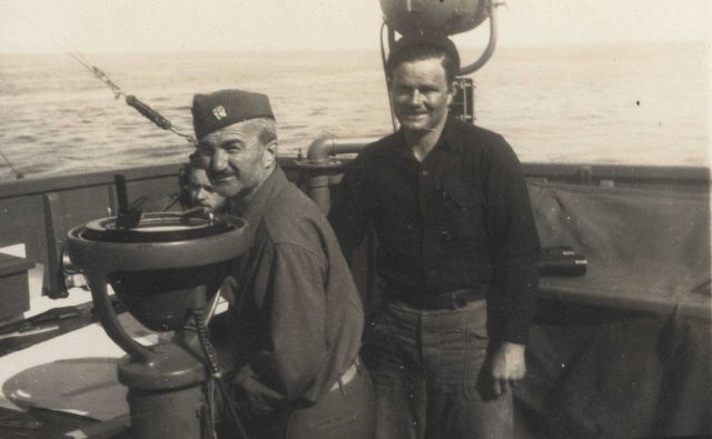 Commander William Malnate behind alidade, W Picture
