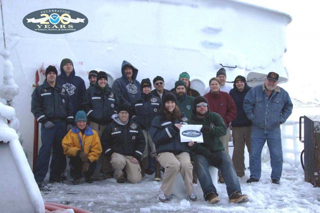 Crew members of the NOAA Ships Miller Freeman and Oscar Dyson pose on the bow of Miller Freeman Picture