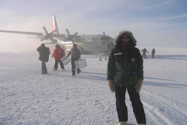 NOAA Earth System Research Laboratory Technician Emrys Hall just after arrival at the South Pole Station on a ski-equipped New York Air National Guard Picture