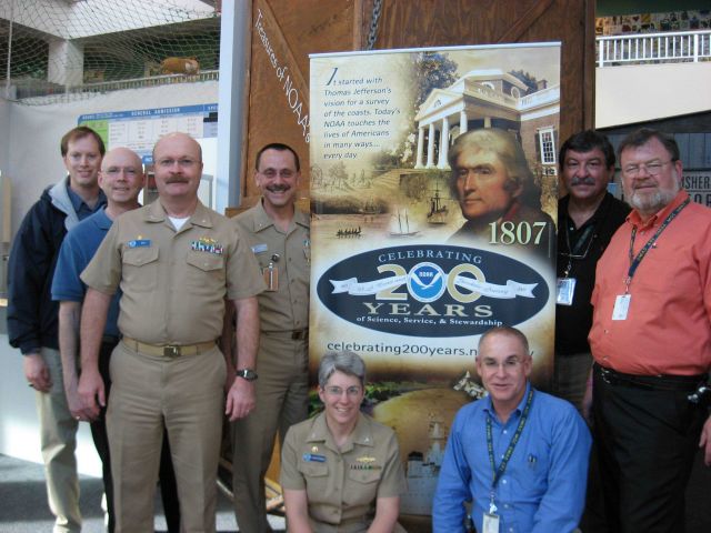 NOAA Corps officers and civilians of NOAA's Office of Marine and Aviation Operations take a break to tour Treasures of NOAA's Ark at Seattle's Pacific Picture