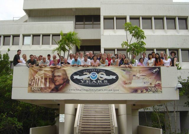 The Physical Oceanography Division of NOAA's Atlantic Oceanographic and Meteorological Laboratory poses for a group photo outside of AOML Picture