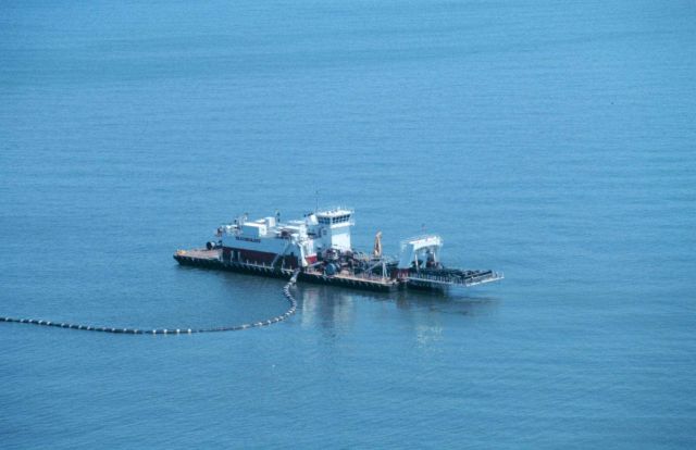 A dustpan dredge, the 