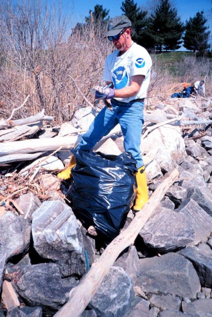 Roger Griffis of NOAA assists in the clean-up at Ft Picture