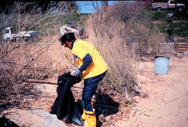 Margaret McCalla of NOAA cleans trash off the beach at Ft Picture