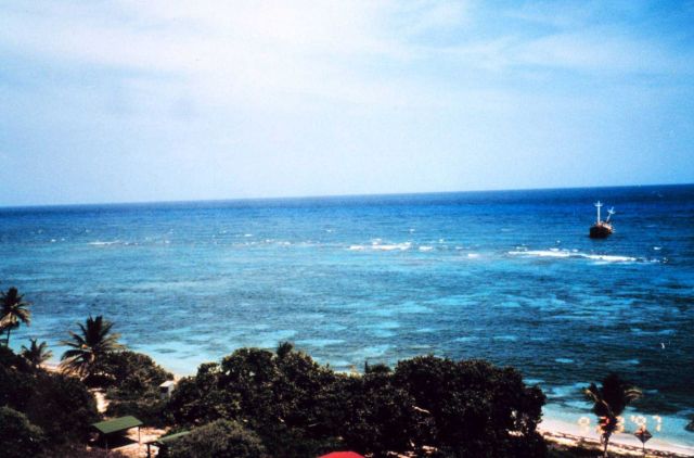 In the foreground, the camp and dock areas used to transport supplies to and from the reef. Picture