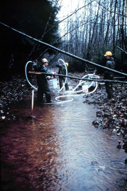 A pump blows air into the riverbed to loosen the sand and gravel so the dredge can work through it later. Picture