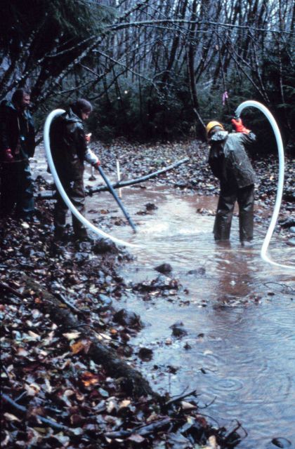 Two men work the pump at Duck Creek. Picture