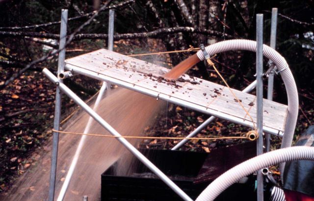 An excellent close-up of the suction dredge process where water and sediments are passing through the screen. Picture
