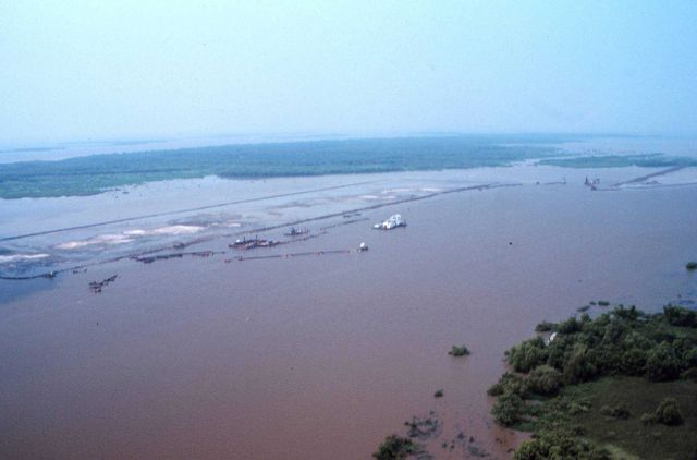 Taken at a higher elevation than the previous image, this image shows the pumping of sediments into the restoration area. Picture
