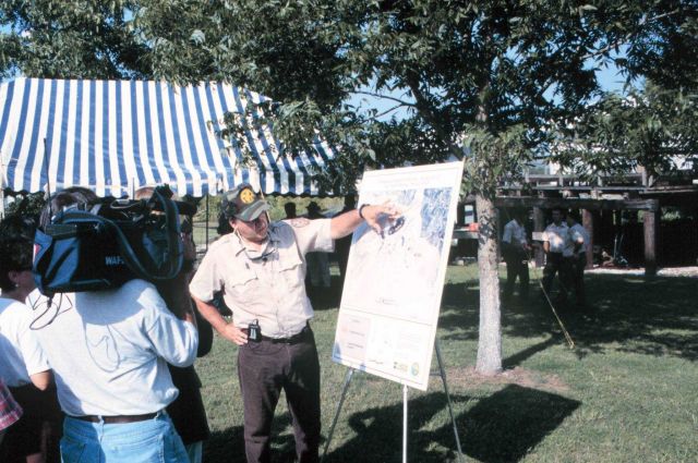 An official from the Louisiana Department of Fisheries and Wildlife briefs the media on the project's features. Picture