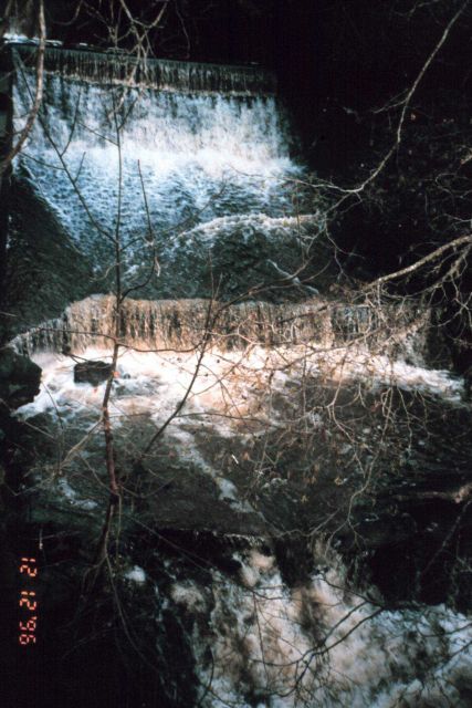 Roy's dam before the restoration during a high flow period. Picture