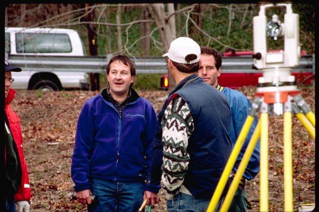 Jim Turek and Eric Hutchins of NOAA discuss the soil testing methods used at the Pilgrim Trail restoration site, Plymouth County, MA. Picture
