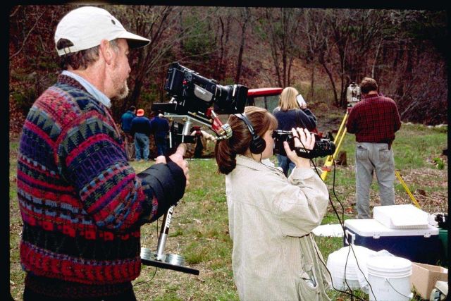 A NOAA contract videographer, Tom Kane, documents the soil testing process and videotapes the student's documentary production efforts. Picture