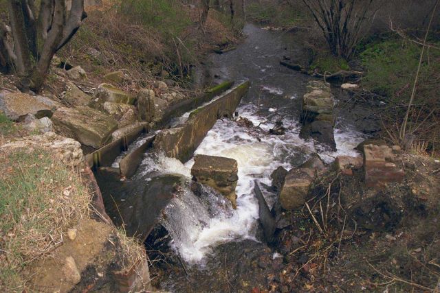 The existing dam on the downstream side at the Town Brook restoration site. Picture