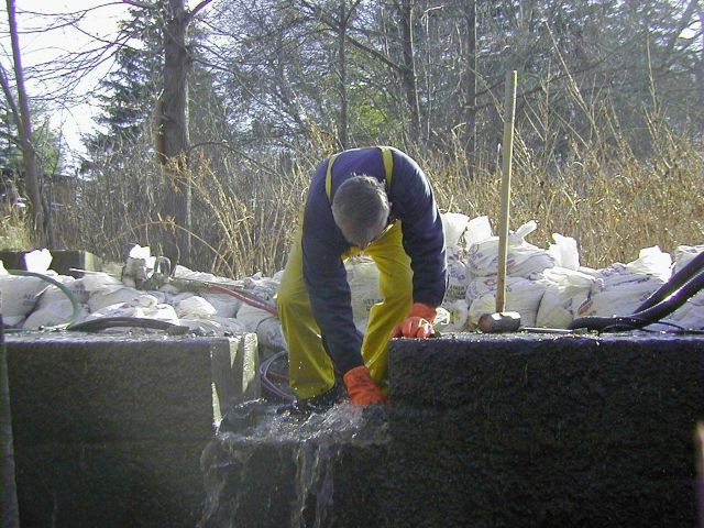 A worker finishes preparations just before installing the ladder. Picture