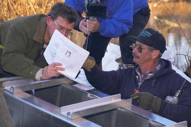 Eric Hutchins of NOAA examines the initial phase of the installment of the Alaskan Steep Pass Ladder. Picture