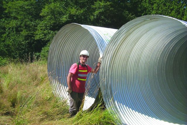 The new pipes that were used to replace the old culvert that inhibited coho and chum salmon from migrating to their spawning grounds. Picture