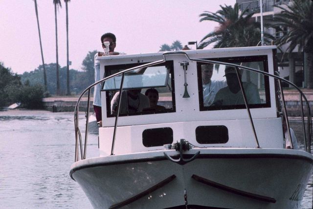 The Reefmaker, a vessel, and volunteers engaged in the clean-up. Picture