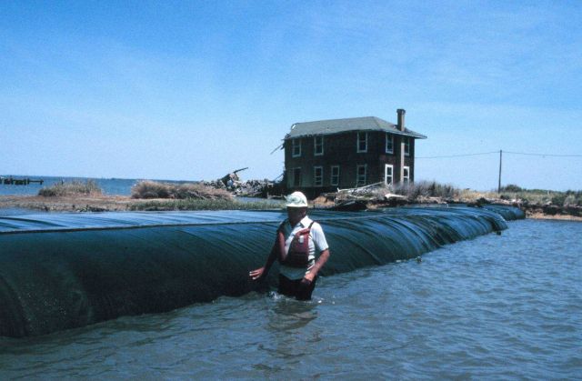 Geotubes filled with dredge material are made of polypropylene Picture