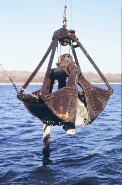 Lowering the reef materials into the water to construct the reefs. Picture