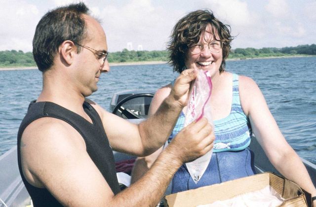 John Catena and Kathy Castro place juvenile lobsters into bags to transport the lobsters onto the reefs. Picture