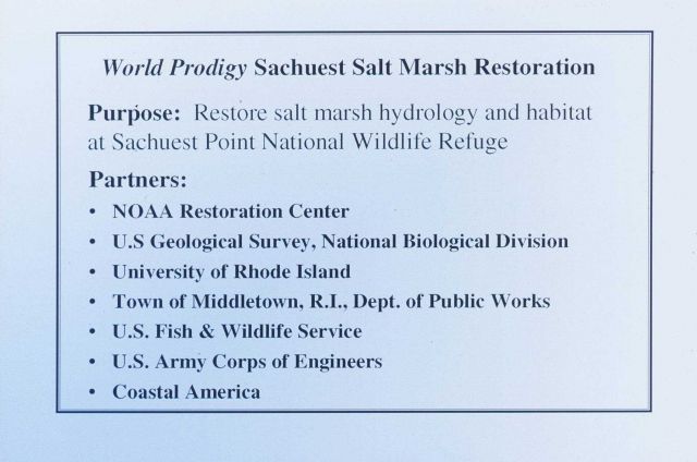 A slide describing the purpose of the restoration at Sachuest Point Salt Marsh and the restoration partners. Picture