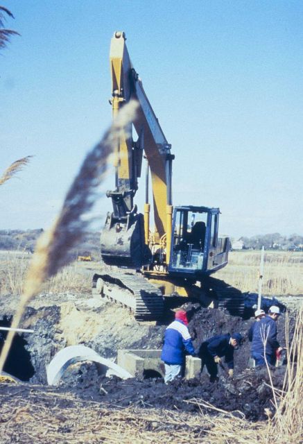 A series of images show the placement of the new culvert at Sachuest Marsh. Picture