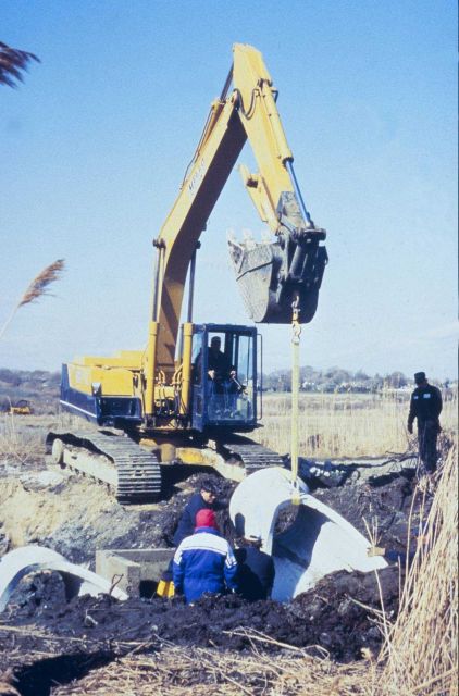 A series of images show the placement of the new culvert at Sachuest Marsh. Picture