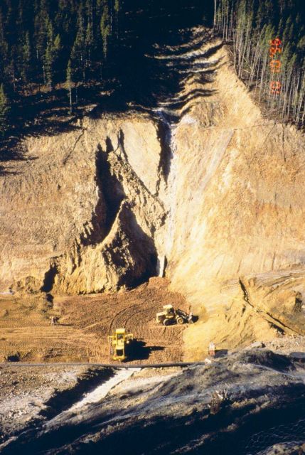 Dumping materials into a large open pit at Blackbird Mine as part of the clean-up work. Picture