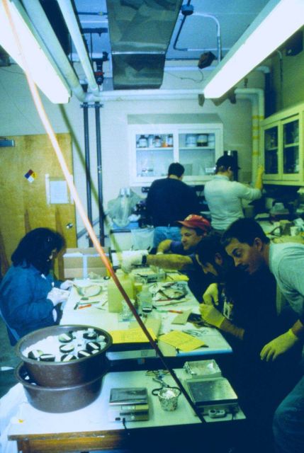 Tracey Collier of NMFS dissects a flounder and removes bile to document exposure to oil. Picture