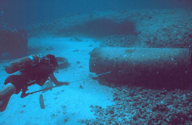 Collecting fish by Hawaiian style spear for determining stomach contents. Picture