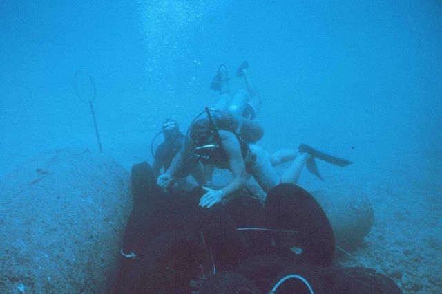Tires being placed in an array to determine their effectiveness as habitat for fish. Picture