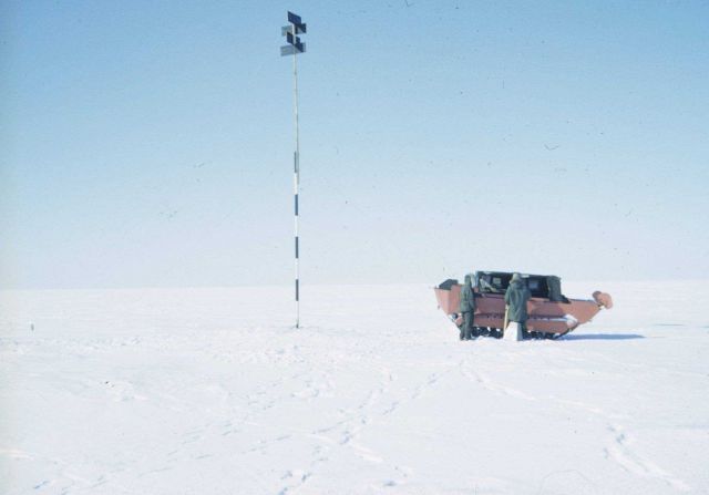 Preparing to go to work observing angles at a survey marker. Picture