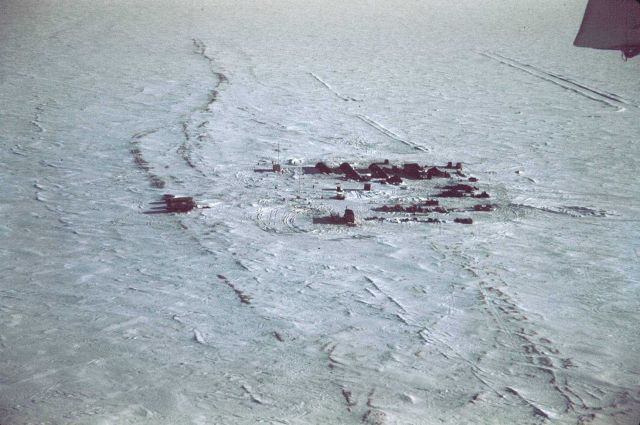 Tigvariak Island Camp from the air - boats to left on beach line. Picture