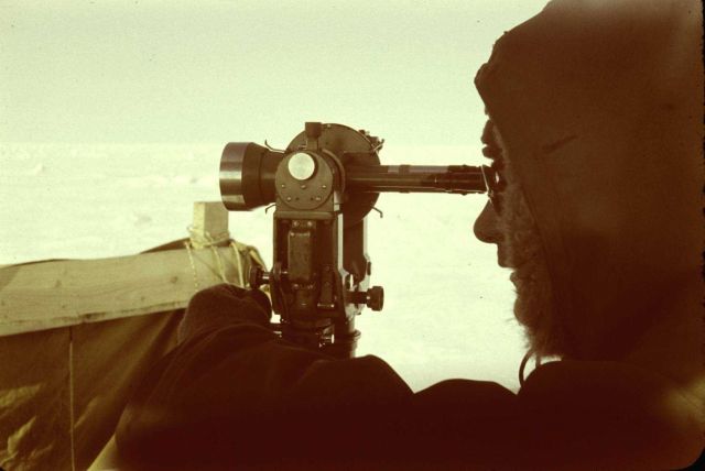 Lieutenant Don Jones observing angles with a T-3 theodolite Picture