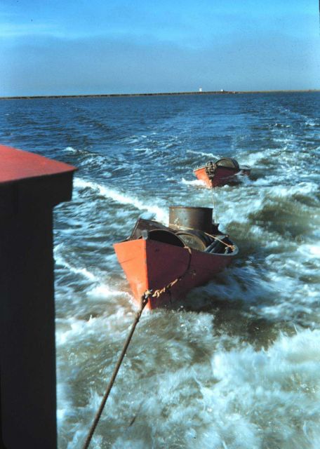 Survey launch towing dinghies after supplying observing camp Picture