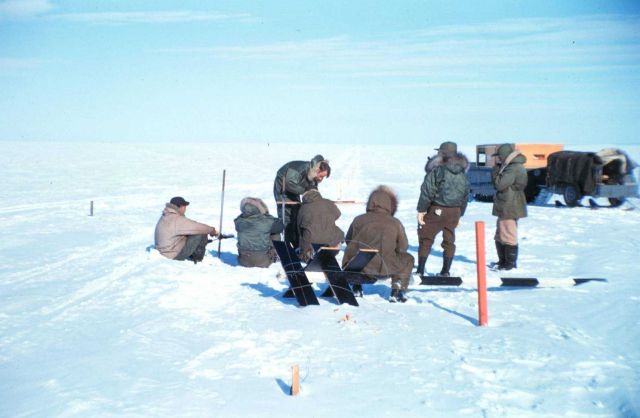 Baseline measurements on the lagoon ice - note stakes along line Picture