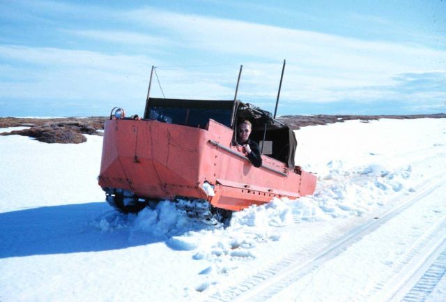 Weasel traveling through the snow with bare tundra in background Weasel driver - Lieutenant Commander Francis X Picture