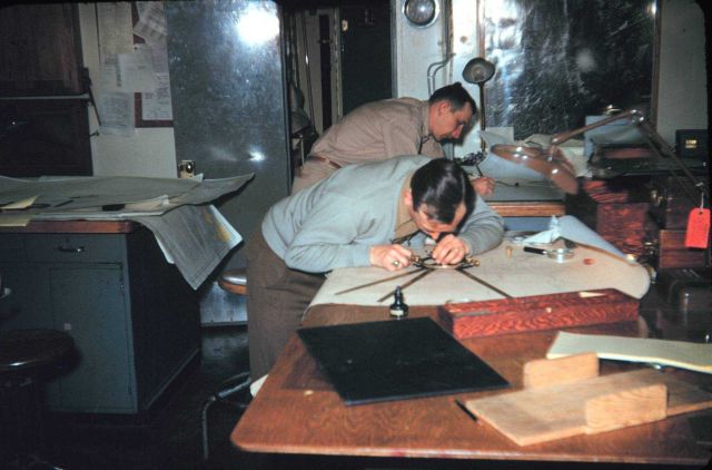 Hal Demuth on the left and Miller Tonkel plotting hydrography Note metallic three-arm protractor Picture