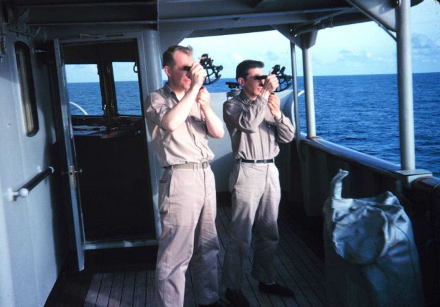 Taking a sun sight with sextants Picture
