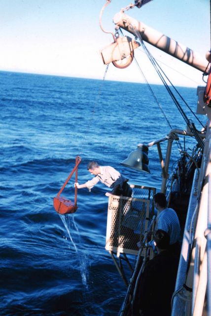 Deploying a Van Vehn grab sampler from the Bureau of Commercial Fisheries Ship BROWN BEAR. Picture