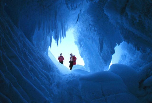 Blue ice on the inside - red coats on the outside at Erebus Glacier tongue Picture