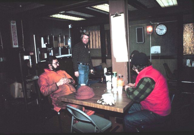 The South Pole dining room with station leader Ron Peck standing; Daryl Leed seated on the right. Picture