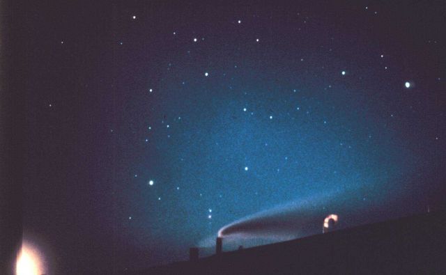 Polar night has arrived - geodesic dome silhouetted by bluish aurora australis Horizontal line emanating to right from geodesic dome is exhaust from g Picture
